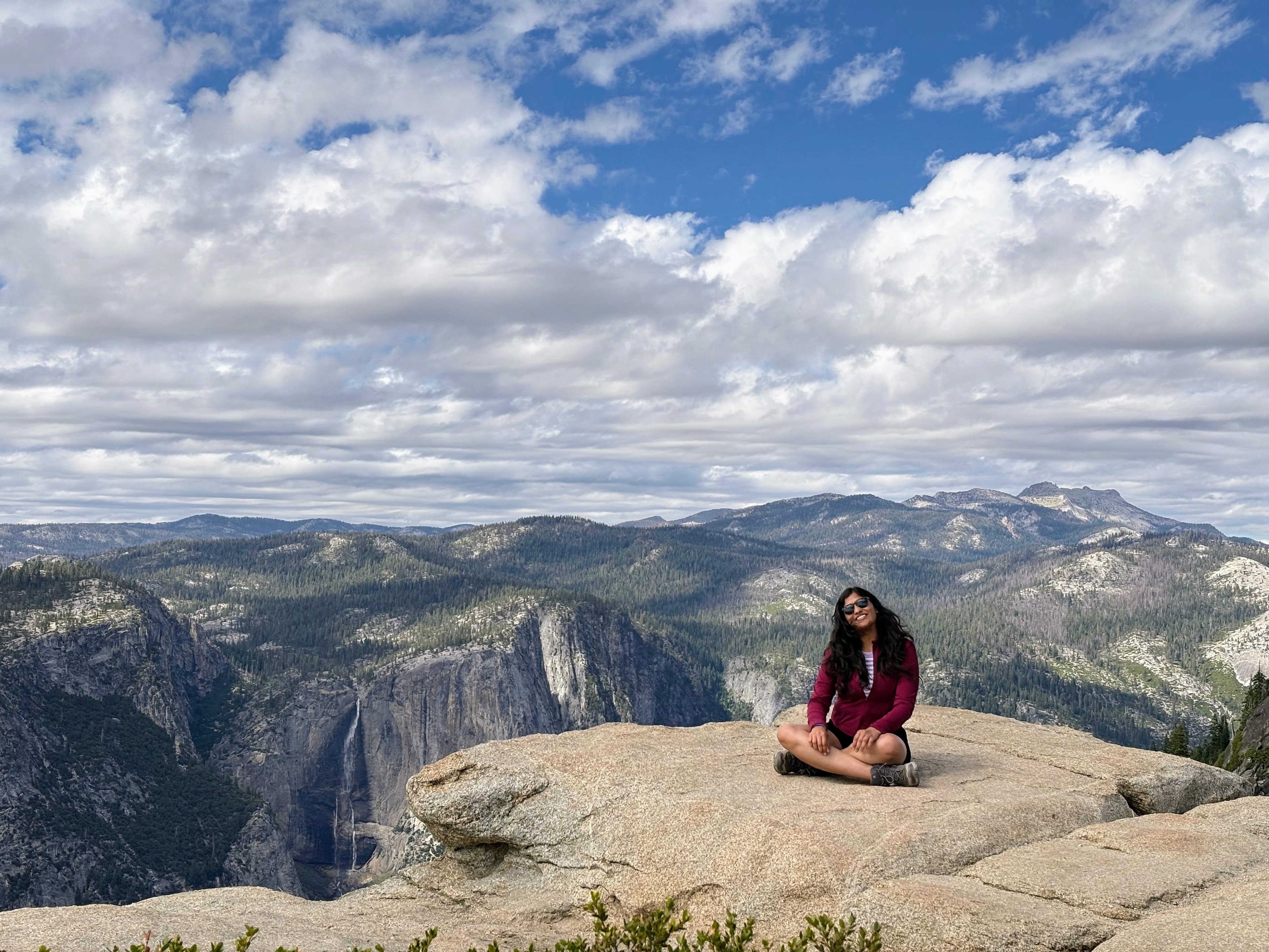 Sitting on a granite overlook above Yosemite Valley.
